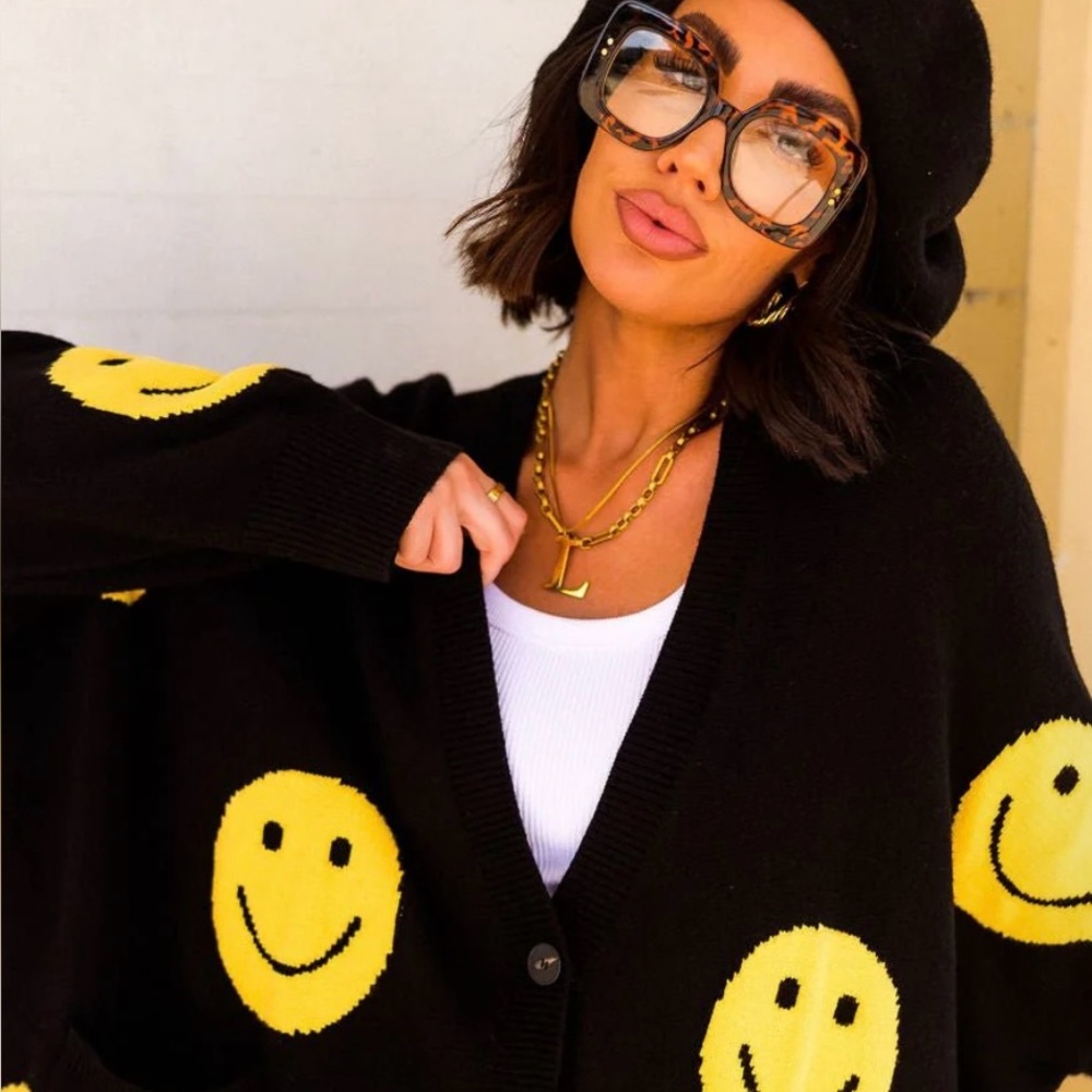 Dressed in Lala Black and Yellow smiley Knit Sweater!